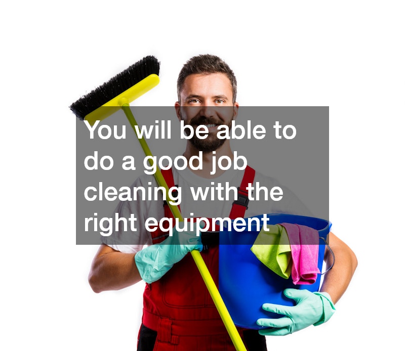 man wearing a red jumper holding a broom in one hand and a bucket in the other